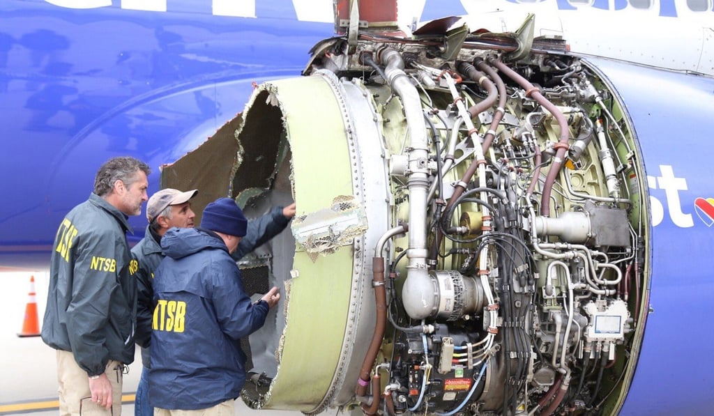 Investigators examine the damaged engine of Southwest Airlines flight 1380 which was en route from LaGuardia Airport in New York City to Love Field in Dallas, Texas when it exploded in flight. Photo: EPA-EFE