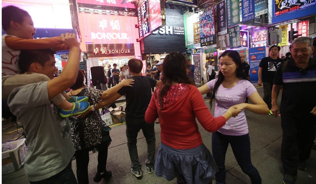 Street performers on Sai Yeung Choi Street South. Photo: Sam Tsang