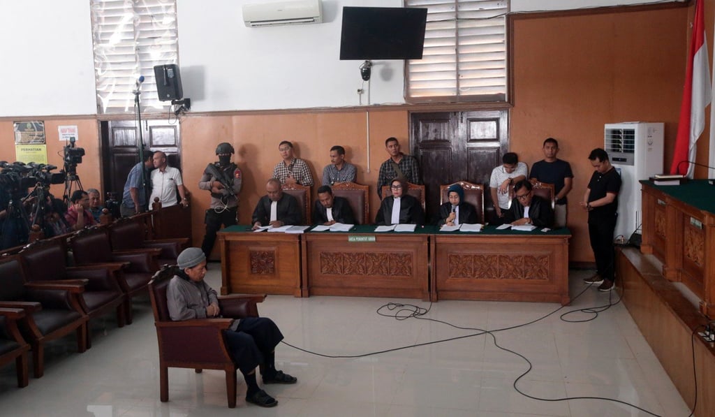 Indonesian suspected terrorist Aman Abdurrahman, alias Oman Rohman, listens to prosecutors during his trial in Jakarta. Photo: EPA Indonesian suspected terrorist Aman Abdurrahman, alias Oman Rohman, listens to prosecutors during his trial in Jakarta. Photo: EPA