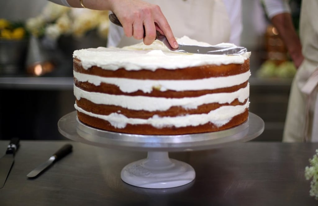 Claire Ptak puts finishing touches to the wedding cake. Photo: Reuters