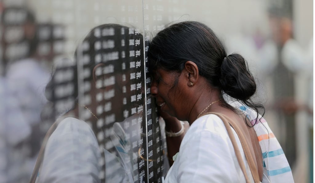 A family member of a soldier who died in the war cries at the memorial in Colombo. Photo: Reuters