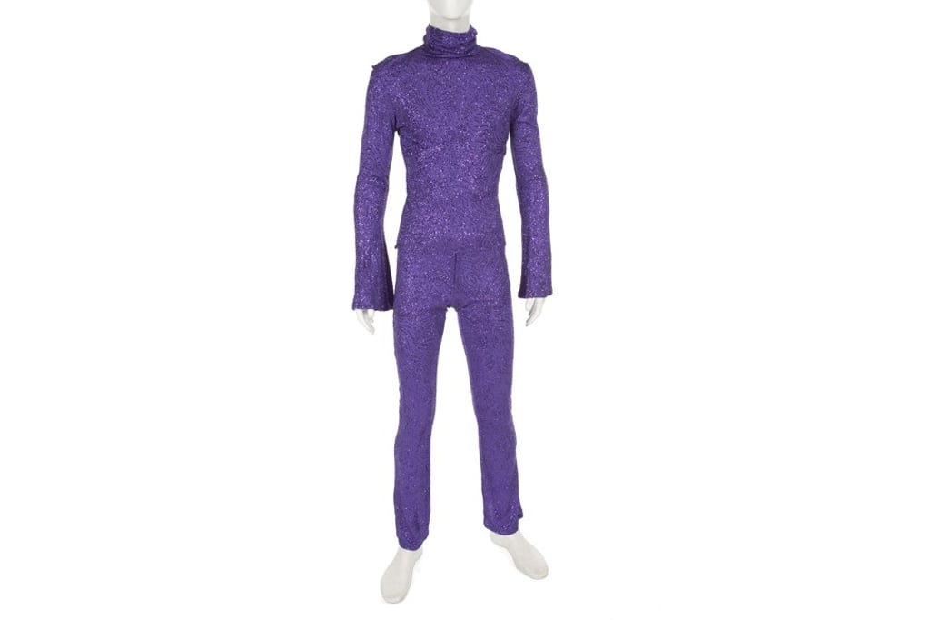 A purple long-sleeve turtleneck jumpsuit with purple glitter sequins worn by Prince during his 1997 Jam of the Year tour. Estimated sale price: US$6,000. Photo: Julien’s Auctions