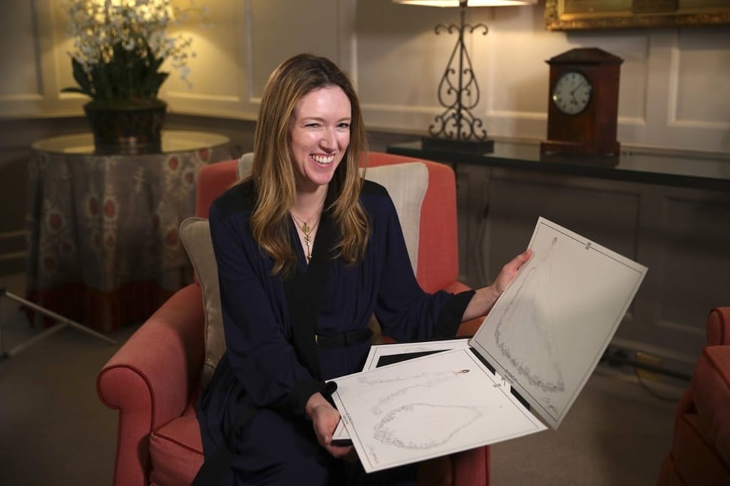 Clare Waight Keller, the British designer of the French fashion house Givenchy, holds sketches of the veil for Meghan Markle’s wedding dress during an interview at Kensington Palace in London on Sunday May 20. Photo: AP