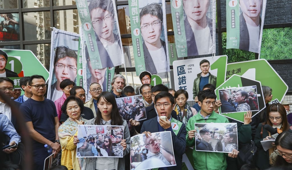 Chow (left) and Law (right) campaign at Kornhill in Tai Koo alongside Au Nok-hin (centre) and other pro-democracy figures ahead of March’s by-election. Photo: Nora Tam