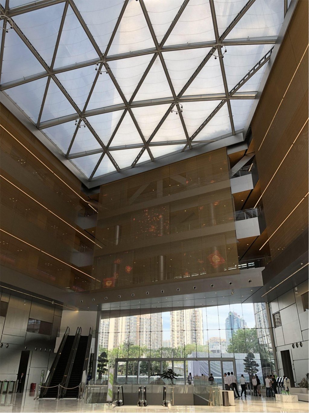 Giant blinds hang from the main lobby at Tencent Holdings’ new corporate headquarters in Shenzhen. The blinds also serve as a backdrop and screen for animation projection. Photo: Chua Kong Ho