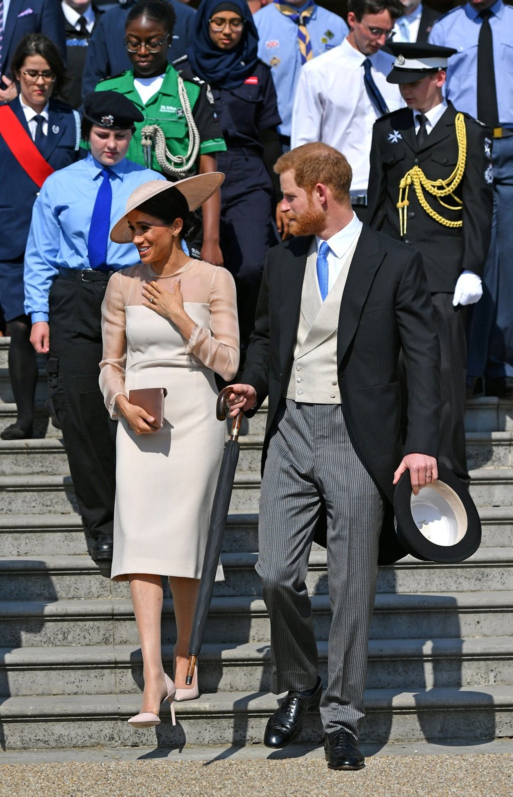 Britain’s Prince Harry and his wife Meghan – Duchess of Sussex – attend a garden party at Buckingham Palace, their first royal engagement as a married couple, in London on May 22, 2018. Photo: Reuters