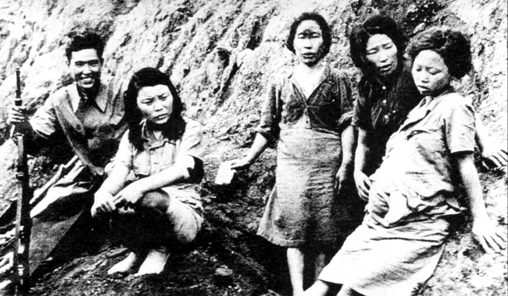 Young Chinese comfort women with a Japanese soldier. They where forced to serve in Japanese military brothels as sex slaves during the Japanese invasion of China.