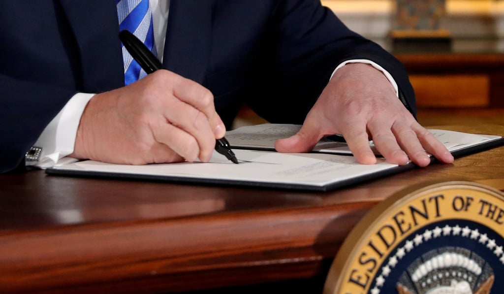 US President Donald Trump signing a proclamation declaring his intention to withdraw from the JCPOA Iran nuclear agreement in Washington on May 8. Photo: Reuters
