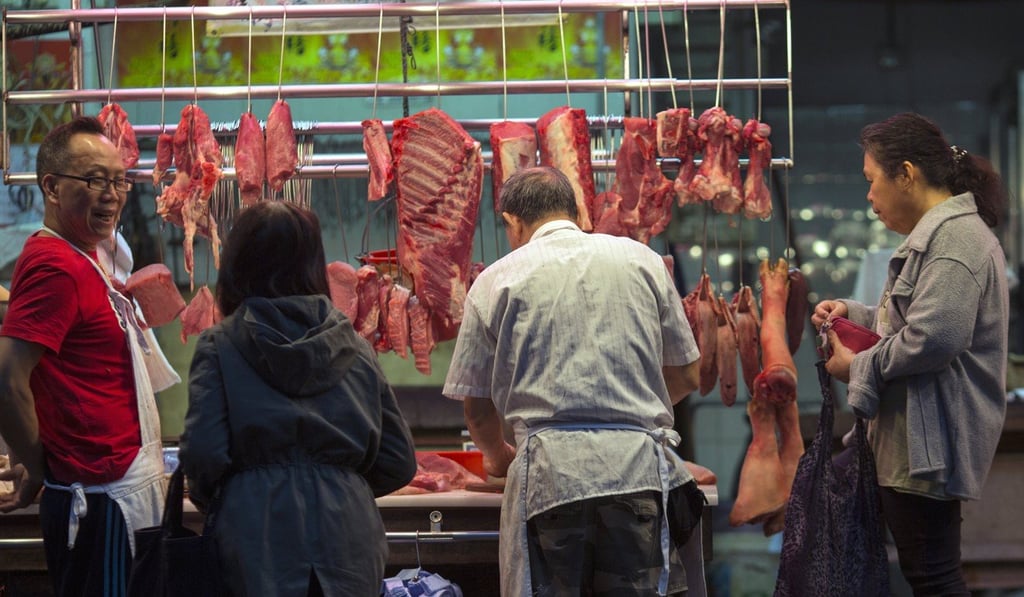 Patrons buy meat from a butcher stall in Hong Kong last year. Photo: EPA