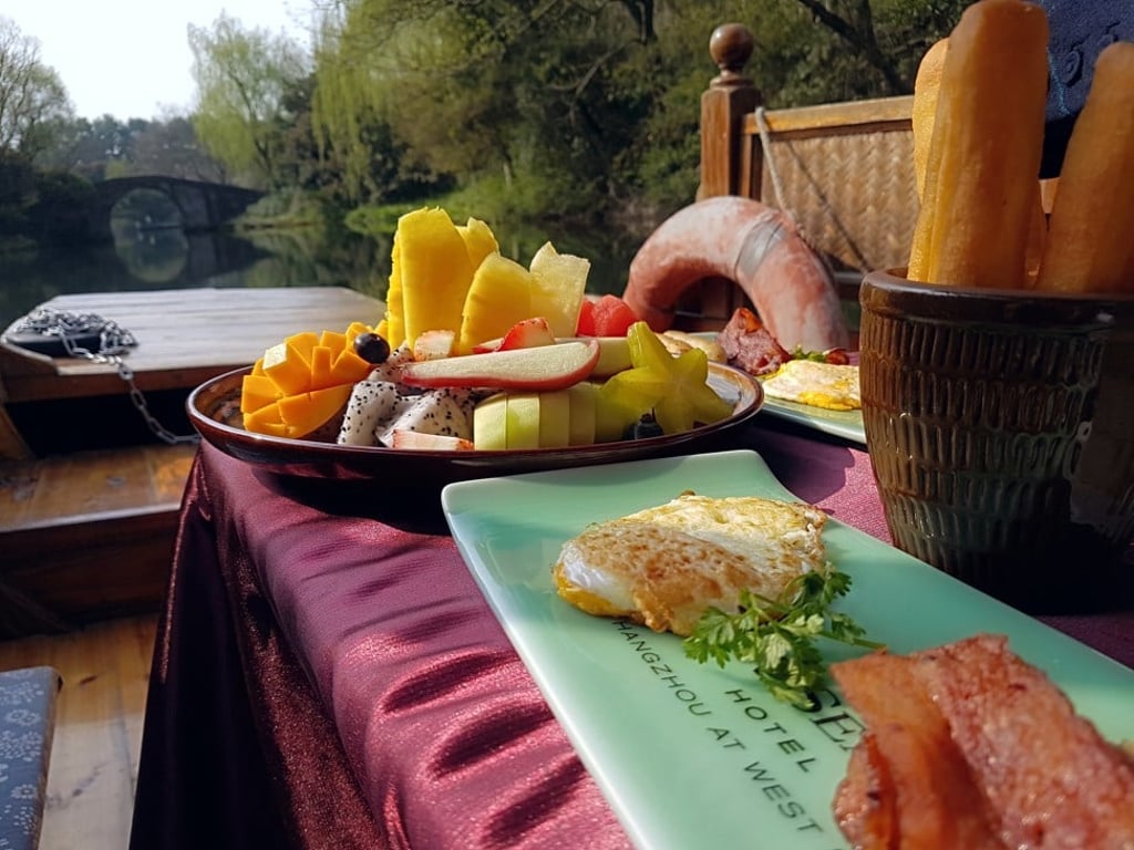Breakfast on a boat on West Lake, by Four Seasons Hangzhou, is a scenic pleasure.