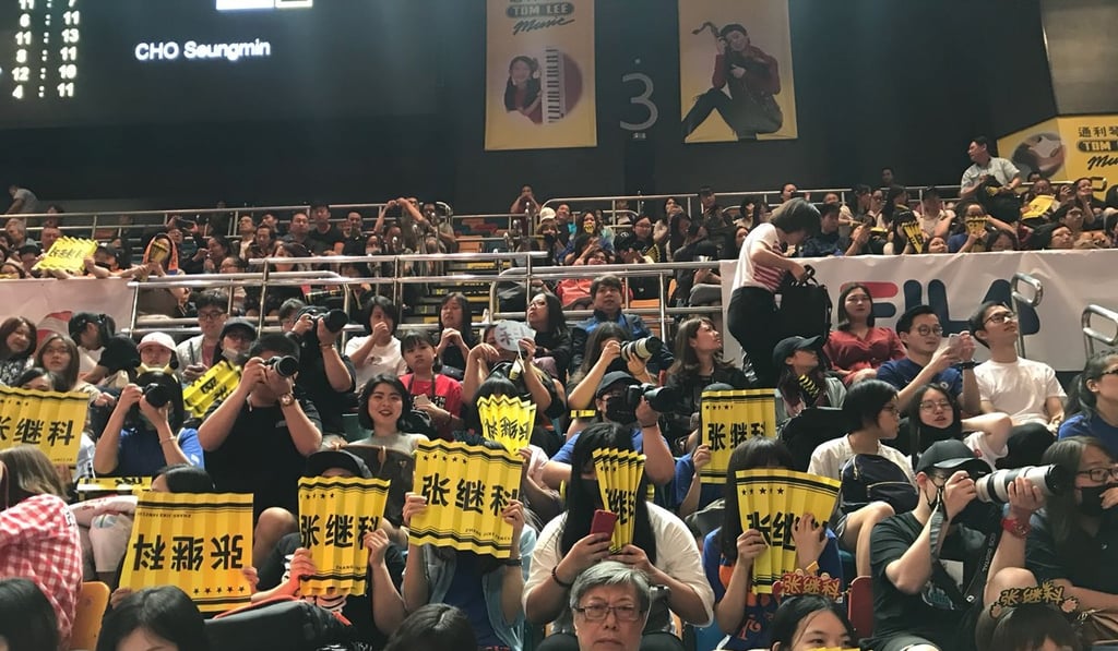 Zhang Jike fans at Queen Elizabeth Stadium show who they are supporting. Photo: Andrew McNicol