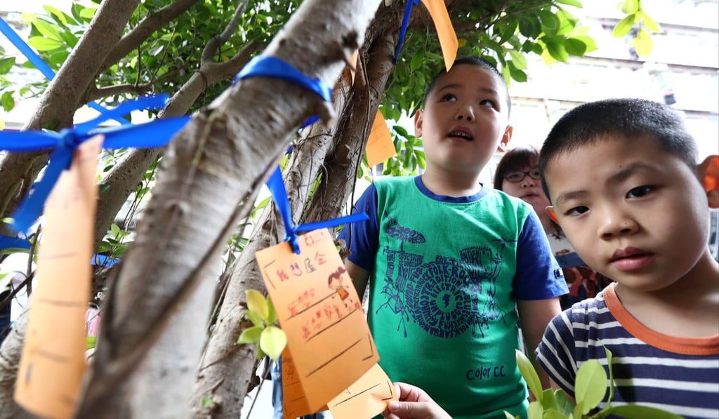 Children in Hong Kong tie their wishes to a tree to mark Children’s Day in April. The day is celebrated on June 1 in mainland China. Photo: Nora Tam