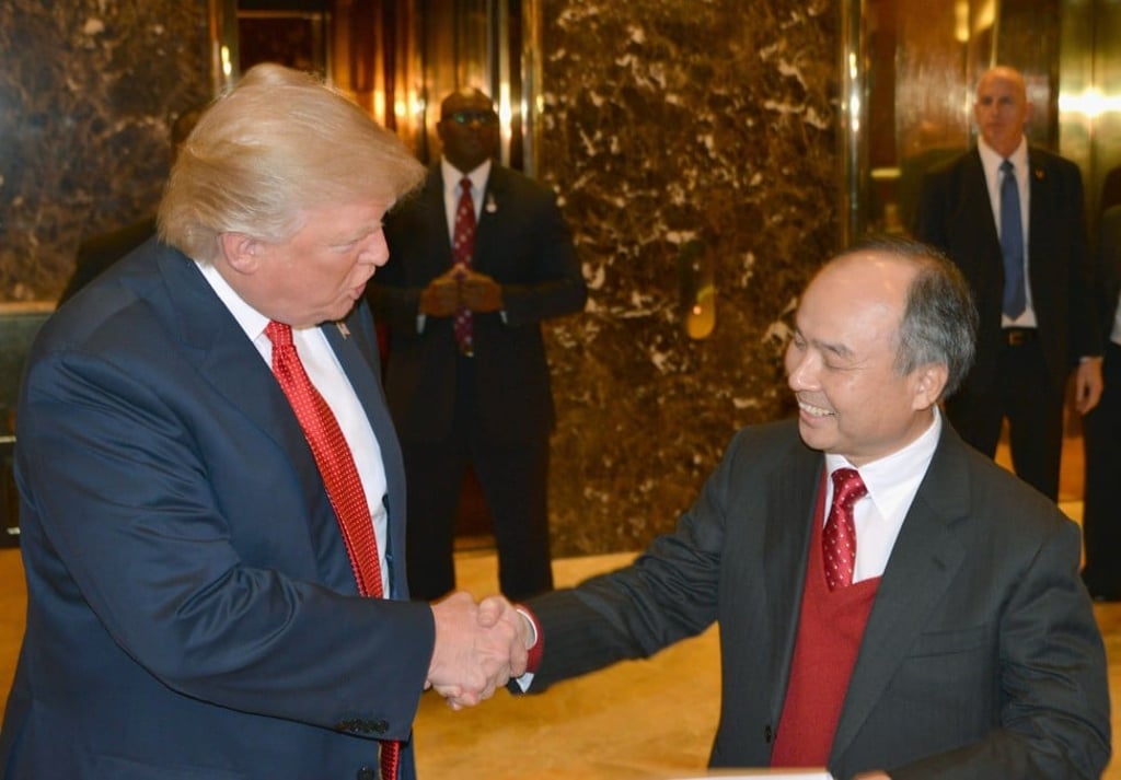 US President-elect Donald Trump (L) and SoftBank’s CEO Masayoshi Son at the lobby of Trump Tower in New York on December 6, 2016. Son told Trump that he would invest US$50 billion in the United States and create 50,000 new jobs. Photo: Kyodo