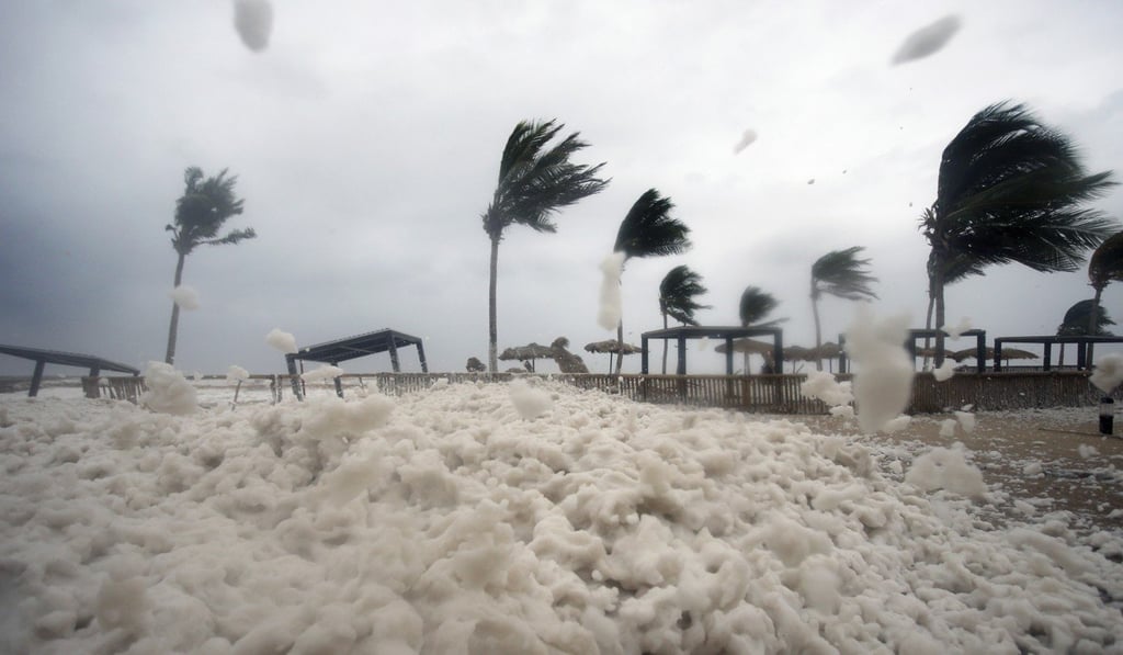 Debris and sea foam litter a beach after Cyclone Mekunu in Salalah, Oman. Photo: AP Debris and sea foam litter a beach after Cyclone Mekunu in Salalah, Oman. Photo: AP