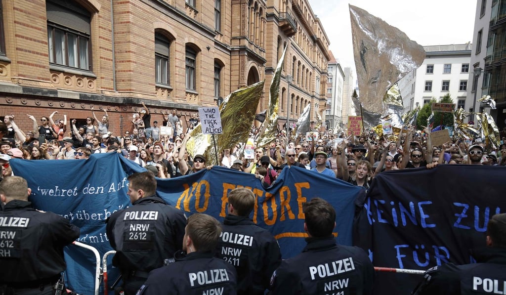 Police officers stand in front of counter-demonstrators holding banners and placards to protest against the ‘demonstration for the future of Germany’ called by the far-right AfD (Alternative for Germany) in Berlin. Photo: AFP Police officers stand in front of counter-demonstrators holding banners and placards to protest against the ‘demonstration for the future of Germany’ called by the far-right AfD (Alternative for Germany) in Berlin. Photo: AFP