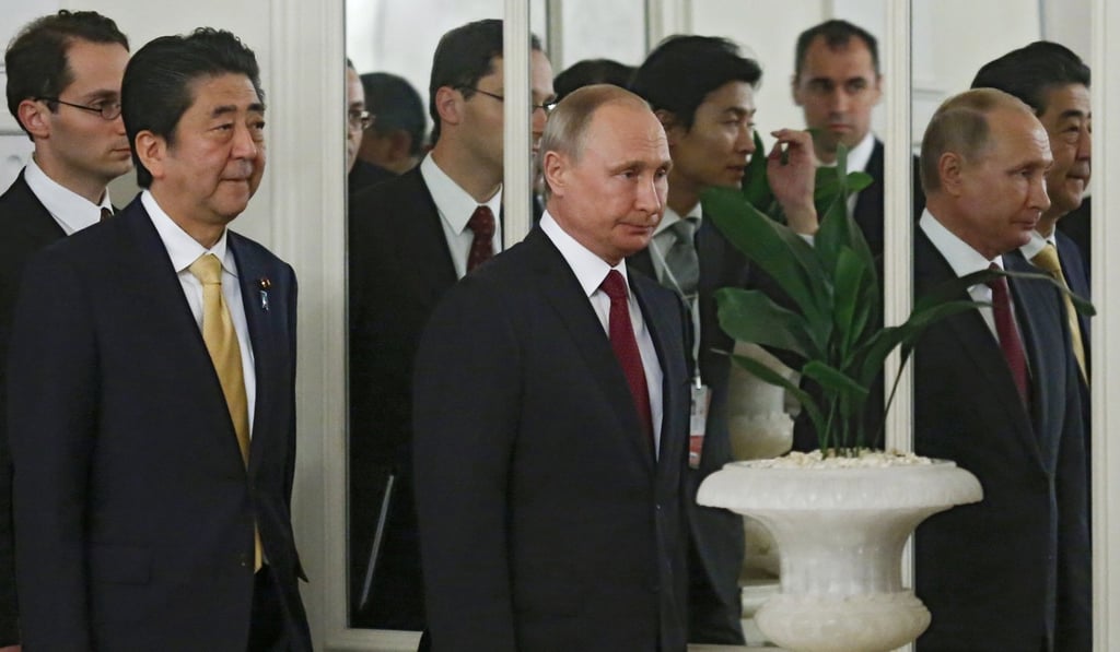 Japanese Prime Minister Shinzo Abe and Russian President Vladimir Putin at the Bolshoi Theatre in Moscow, Russia on Saturday. Photo: EPA Japanese Prime Minister Shinzo Abe and Russian President Vladimir Putin at the Bolshoi Theatre in Moscow, Russia on Saturday. Photo: EPA