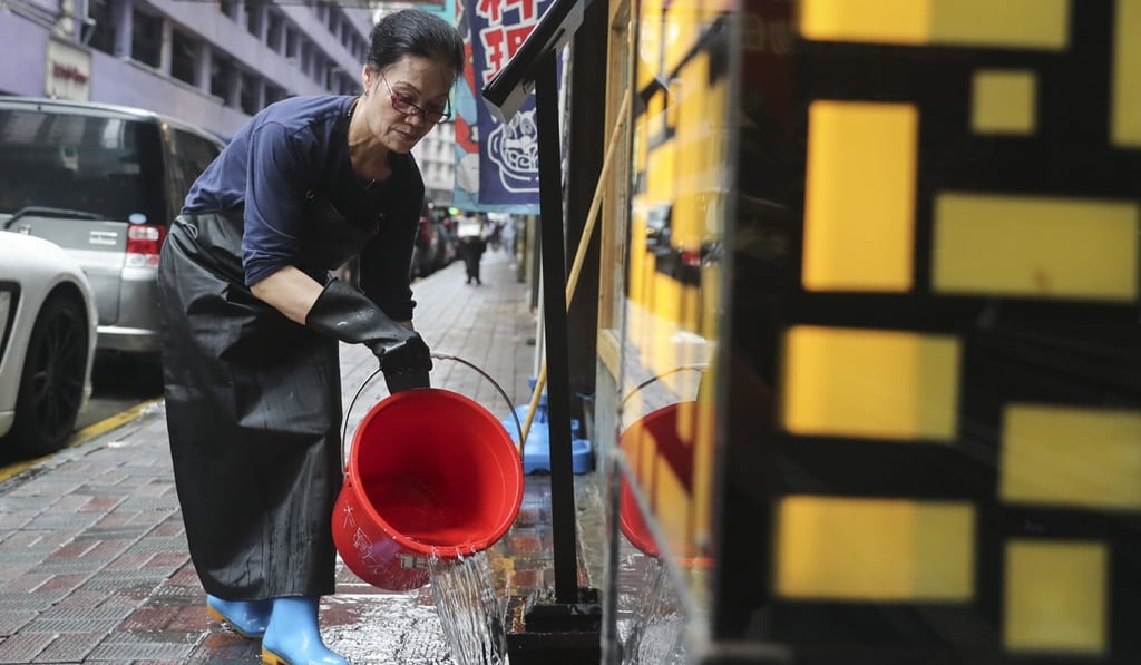 A worker cleans up outside a restaurant. Hong Kong’s income inequality, as measured by its Gini coefficient, has reached a historic high. Photo: Sam Tsang