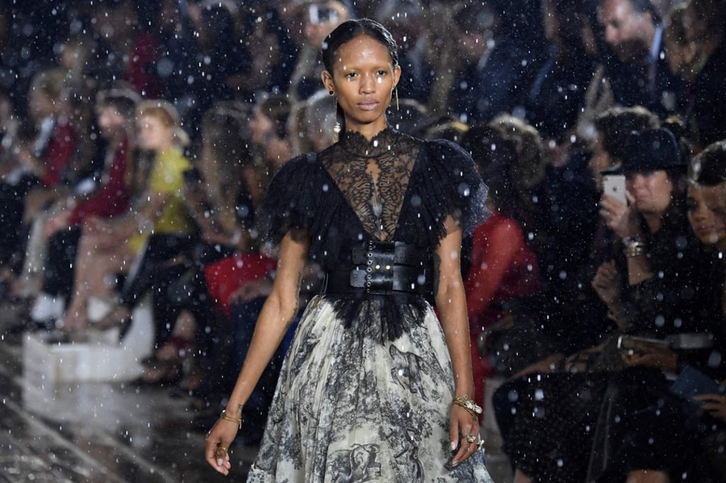 Models parade in driving rain during Dior’s fashion show at Chantilly chateau. Photo: Agence France-Presse Models parade in driving rain during Dior’s fashion show at Chantilly chateau. Photo: Agence France-Presse