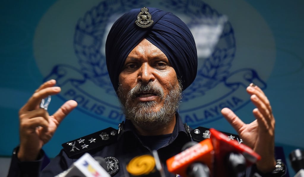 Malaysian police chief Amar Singh addresses the media after conducting raids related to the 1MDB scandal. Photo: AFP Malaysian police chief Amar Singh addresses the media after conducting raids related to the 1MDB scandal. Photo: AFP