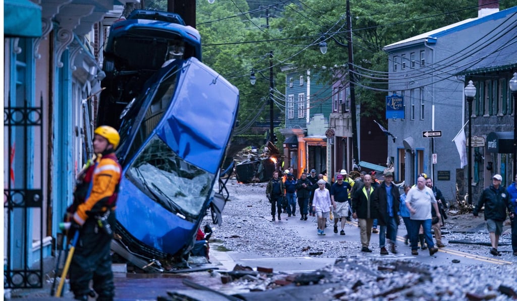 Rescue personnel examine damage on Main Street after a flash flood rushed through the historic town of Ellicott City, Maryland. Photo: EPA