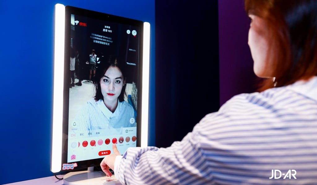 A customer trying on lipstick using JD's AR beauty mirror.