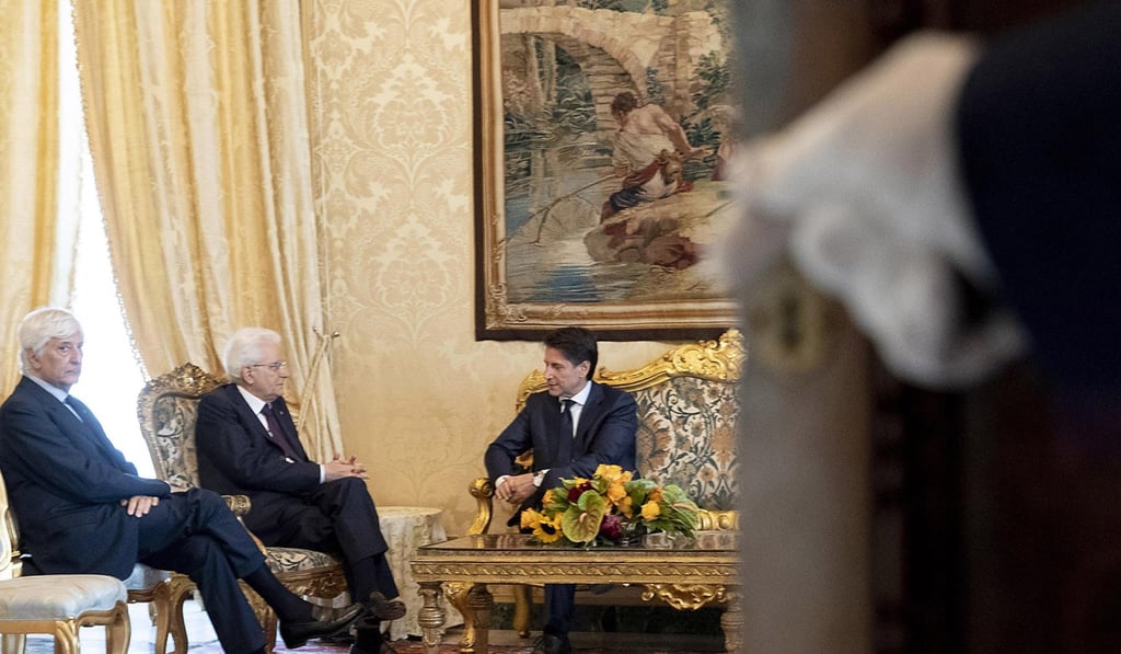 Italian President Sergio Mattarella (centre) receives Giuseppe Conte (right), who was proposed as prime minister by the right-wing populist League and the Five Star movement, in Rome on May 27. Conte has decided not to lead what would have been western Europe's first populist government. Photo: Quirinale Press Office