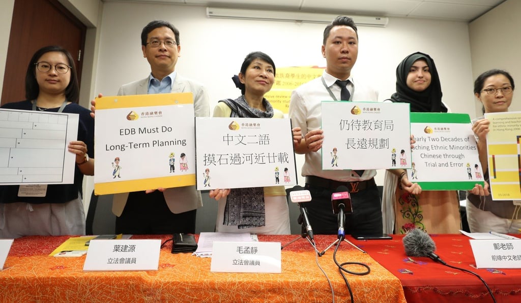 (From left): Li Sin-lam, Ip Kin-yuen, Claudia Mo, teacher Mr Kwong, Khan Huma Nisa and Phyllis Cheung. Photo: Winson Wong