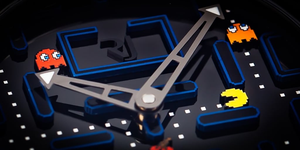 A close-up view of the face of RJ’s PAC-MAN™ Level III timepiece
