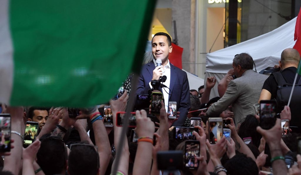 Five Star Movement leader Luigi Di Maio speaks to supporters during a meeting in Naples, Italy, on May 29. Di Maio called for mass mobilisation in support of the party’s bid to impeach President Sergio Mattarella after Mattarella refused to approve populist leaders' choice of an economy minister. The political uncertainty does not bode well for Italy’s economic prospects or the stability of the euro zone. Photo: EPA-EFE