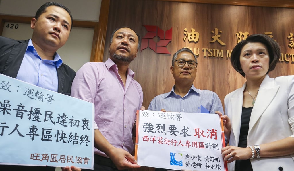 From left, Yau Tsim Mong district councillor Wong Kin-san, James Wong of the Transport Department, district councilor Chan Siu-tong and district coucil vice-chair Wong Shu-ming attend a council meeting on closing the Sai Yeung Choi Street pedestrian zone at the Mong Kok government offices. Photo: Dickson Lee