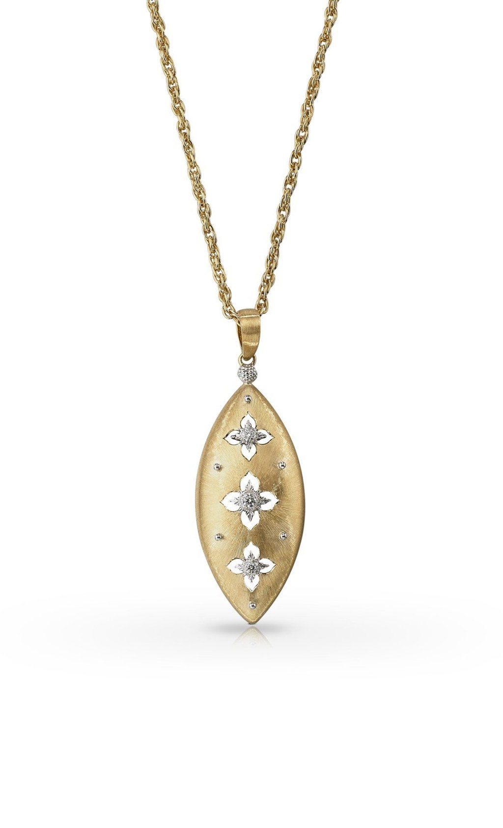 A pendant in yellow gold and white gold set with three round brilliant-cut diamonds from the Macri Giglio line. In this line, the lily is used as a decorative motif.