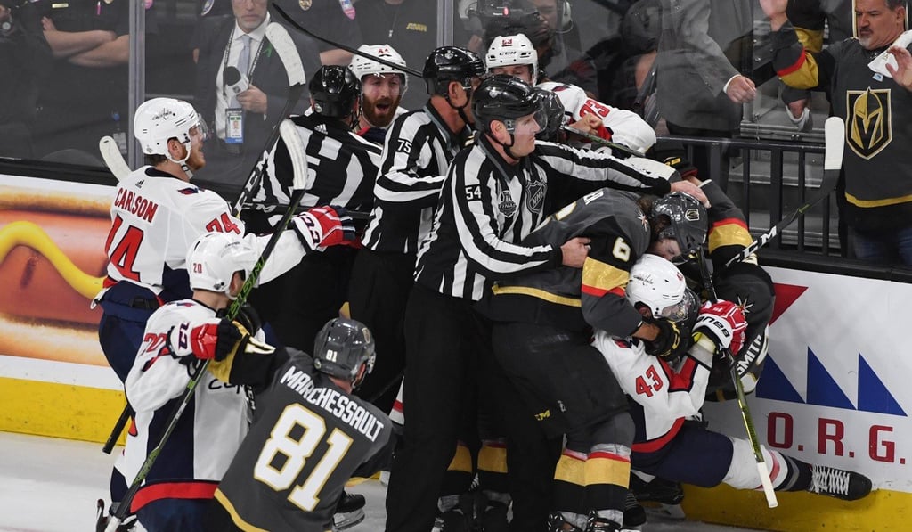 Vegas Golden Knights defenseman Colin Miller tackles Washington Capitals right wing Tom Wilson starting a melee. Photo: USA Today