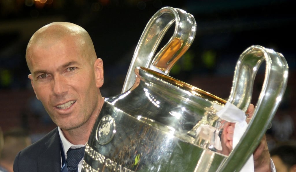 Zinedine Zidane poses with the trophy after Real Madrid won the Uefa Champions League final. Photo: AFP Zinedine Zidane poses with the trophy after Real Madrid won the Uefa Champions League final. Photo: AFP