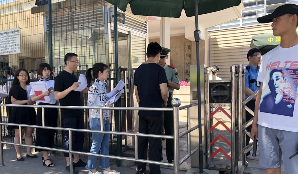 Chinese citizens line up for visa interviews outside the US embassy in Beijing on Wednesday. The US plans to shorten the length of some visas issued to Chinese citizens from June 11. Photo: Simon Song