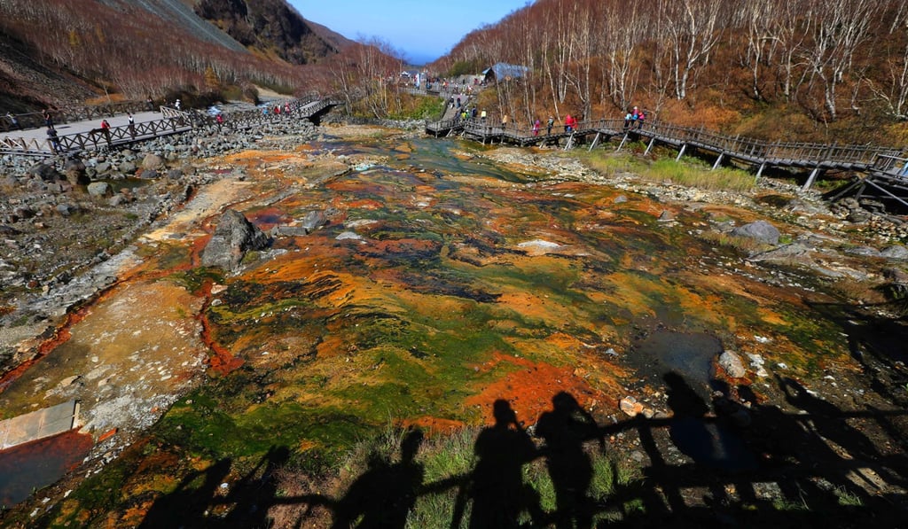 Tourists admire a hot spring on Changbai Mountain in Jilin. Photo: Xinhua Tourists admire a hot spring on Changbai Mountain in Jilin. Photo: Xinhua