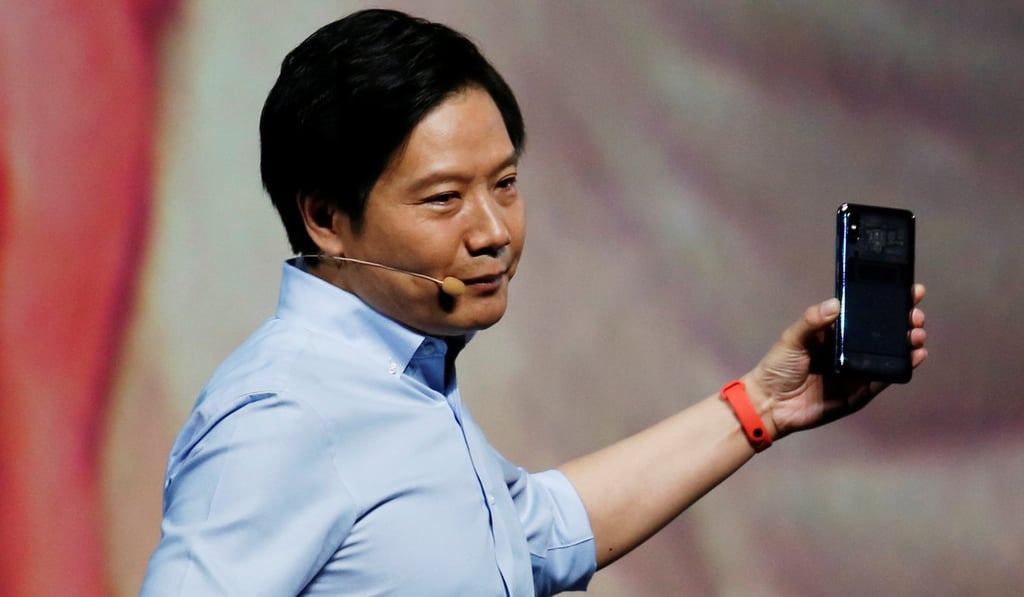 Lei Jun, the founder, chairman and chief executive of Xiaomi, shows off the company’s flagship smartphone, the Mi 8 Explorer Edition, at a launch in Shenzhen on Thursday. Photo: Reuters
