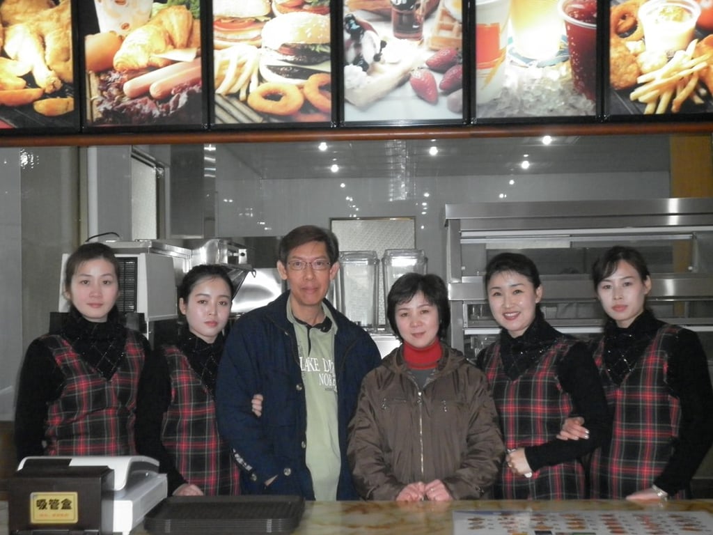 Patrick Soh and staff at a Samtaesong restaurant in Pyongyang. Photo: Courtesy