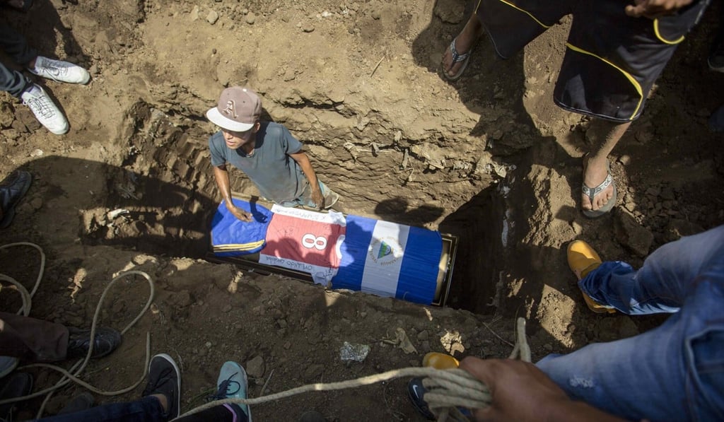 A Nicaraguan flag and a football shirt on the coffin of Orlando Cordoba, the teenager killed on May 30. Photo: EPA A Nicaraguan flag and a football shirt on the coffin of Orlando Cordoba, the teenager killed on May 30. Photo: EPA