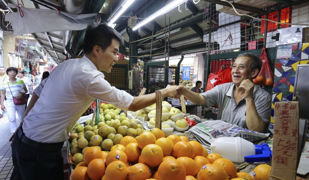 Sou with a supporter after he won his seat, having picked up more than 9,000 votes. Photo: Dickson Lee