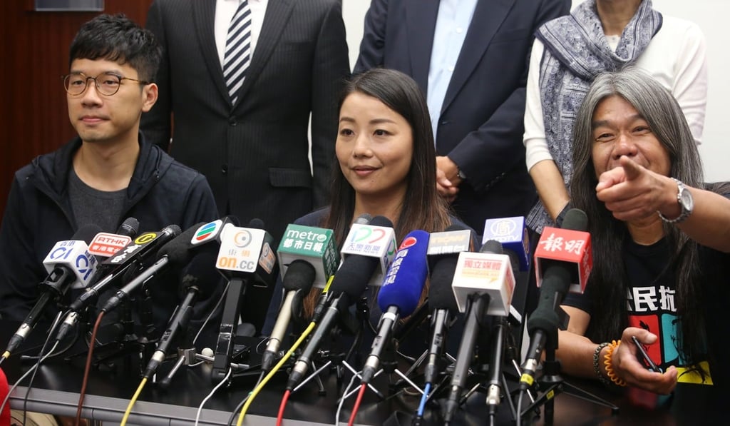 Nathan Law Kwun-chung (left); Lau Siu-lai and Leung Kwok-hung were among six lawmakers disqualified over their improper oath-taking. Photo: David Wong