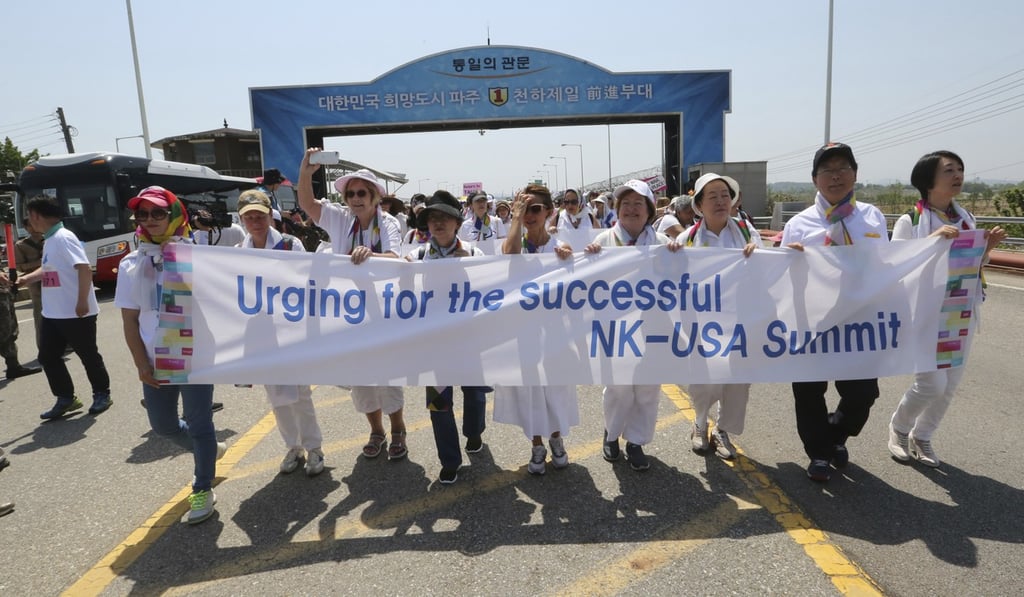 Activists cross the Unification Bridge, which leads to Panmunjom in the demilitarised zone, during the 2018 DMZ Women Peace Walk on May 26. Photo: AP Activists cross the Unification Bridge, which leads to Panmunjom in the demilitarised zone, during the 2018 DMZ Women Peace Walk on May 26. Photo: AP