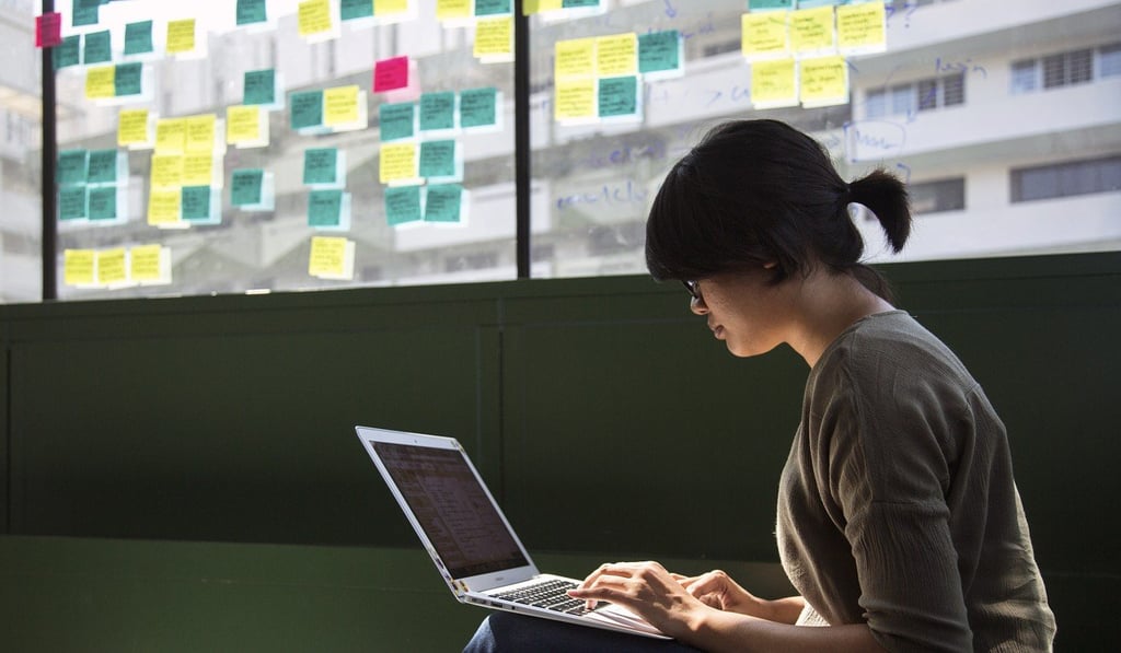 An employee works on a laptop computer at the Carousell headquarters in Singapore. Photo: Bloomberg An employee works on a laptop computer at the Carousell headquarters in Singapore. Photo: Bloomberg