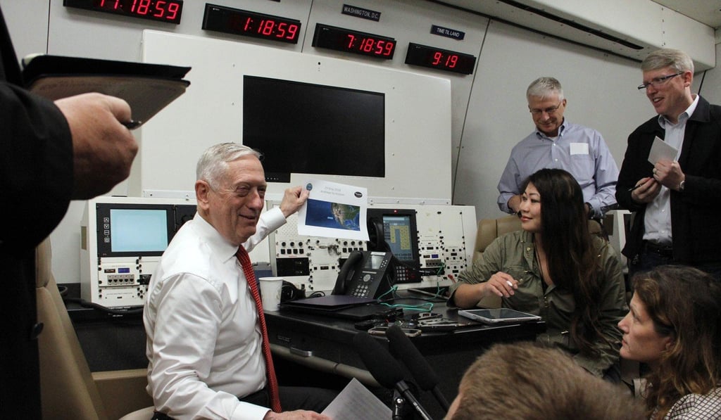 US Defence Secretary Jim Mattis speaks to reporters on board a US military plane en route to Hawaii on May 29. Mattis said the US will continue to confront China over its territorial claims in the South China Sea. Photo: AFP