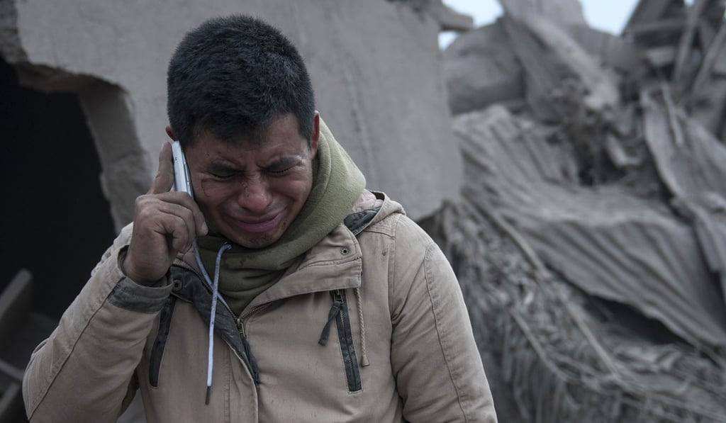 Boris Rodriguez, 24, who is searching for his wife, cries after seeing the condition of his neighbourhood, destroyed by the erupting Volcan de Fuego in Escuintla, Guatemala, on Monday. Photo: AP Boris Rodriguez, 24, who is searching for his wife, cries after seeing the condition of his neighbourhood, destroyed by the erupting Volcan de Fuego in Escuintla, Guatemala, on Monday. Photo: AP