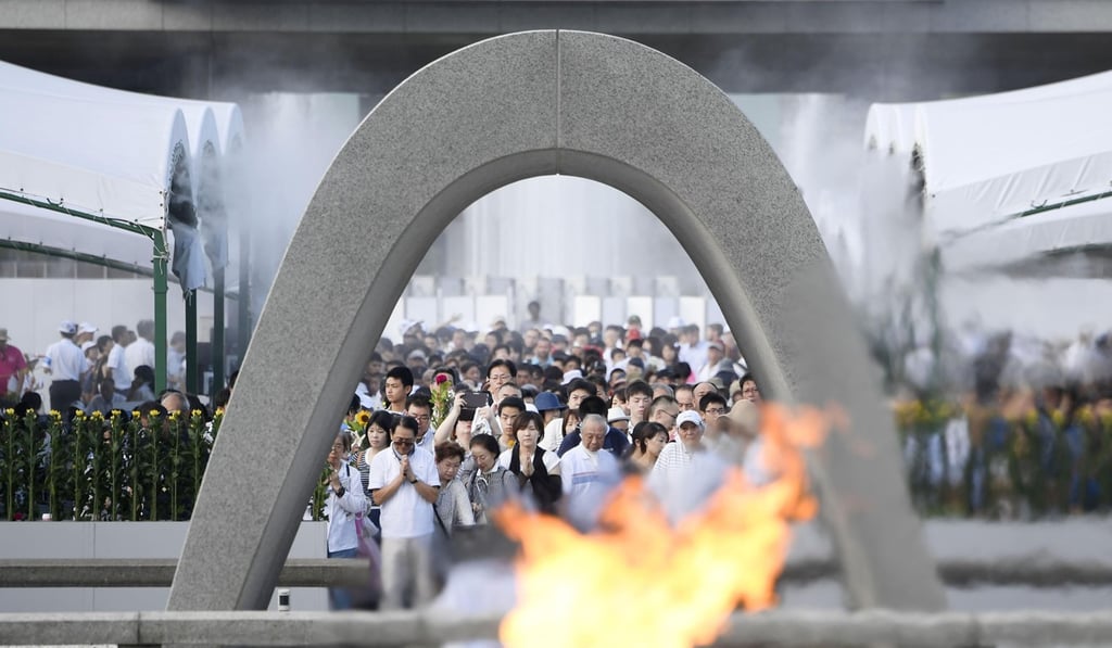 People offer prayers at the Peace Memorial Park in Hiroshima on August 6, 2017, to mark the 72nd anniversary of the world' s first atomic bombing. Photo: Kyodo News via AP
