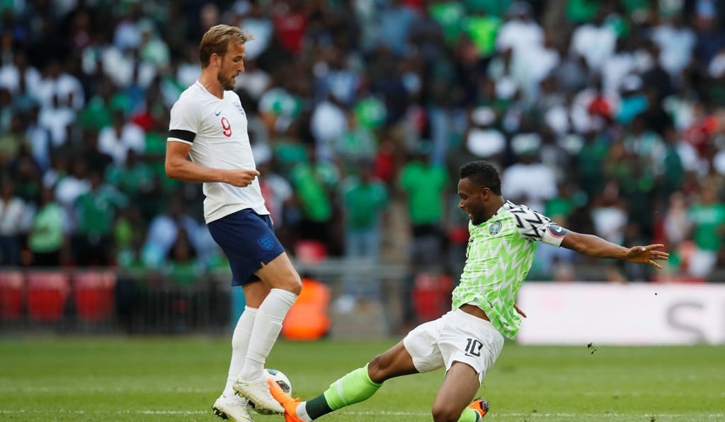 England’s Harry Kane in action with Nigeria’s John Obi Mikel. Photo: Reuters