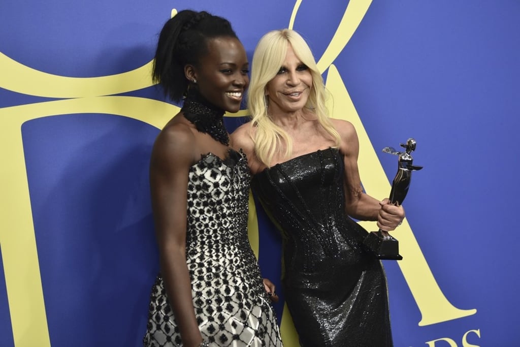 Actress Lupita Nyong'o (left), and fashion designer Donatella Versace, winner of the international award, at the CFDA Fashion Awards at Brooklyn Museum, in New York, on Monday. Photo: AP
