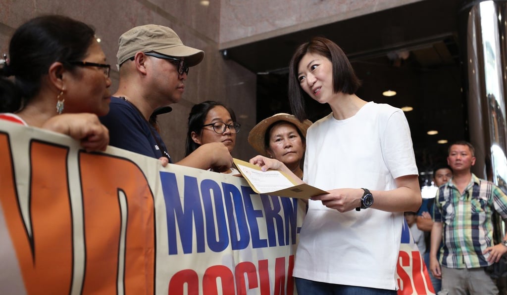 New People’s Party lawmaker Eunice Yung Hoi-yan meets foreign domestic workers’ groups protesting against her remarks criticising their public gatherings, in Central on May 27. Yung has apologised for her comments. Photo: Winson Wong