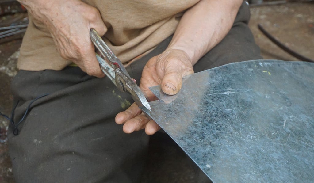 Ho Wing-sun is an artisan galvanised iron craftsman. He uses simple tools for his craft, such as this pair of strong cutters. Photo: Olivia Chan
