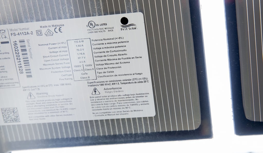 A First Solar Inc label is seen on the backside of a solar panel in Selmer, Tennessee in May. Photo: Bloomberg A First Solar Inc label is seen on the backside of a solar panel in Selmer, Tennessee in May. Photo: Bloomberg